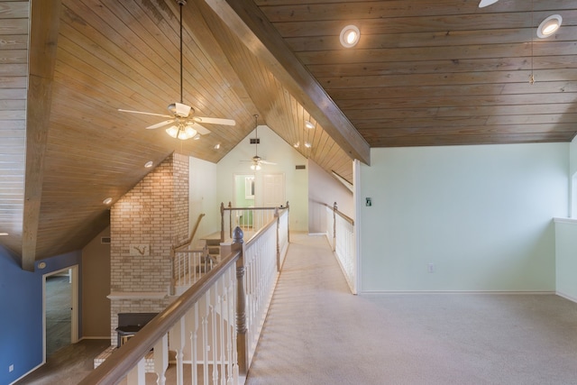 hallway with lofted ceiling, carpet, and wood ceiling