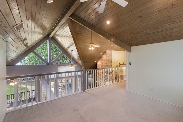 hallway with carpet floors, wooden ceiling, and beam ceiling