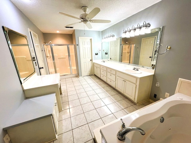 bathroom with tile patterned floors, shower with separate bathtub, a textured ceiling, vanity, and ceiling fan