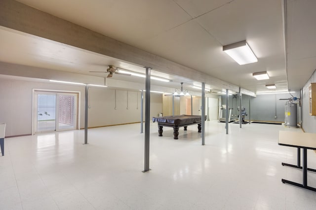 basement featuring water heater and ceiling fan