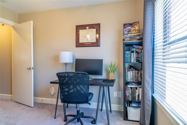 office with light carpet and a wealth of natural light