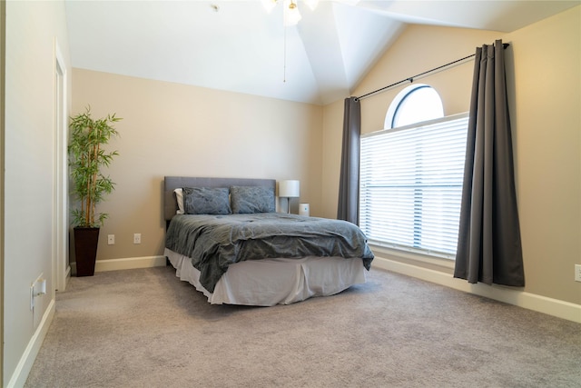 bedroom featuring lofted ceiling and light colored carpet