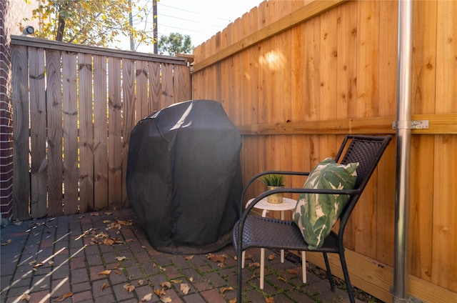 view of patio featuring a grill