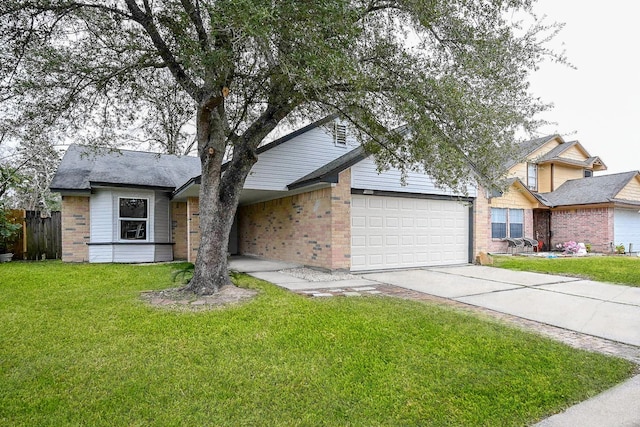 view of front of house featuring a garage and a front lawn