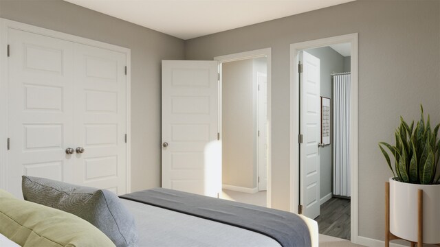 bedroom with ensuite bath and a closet