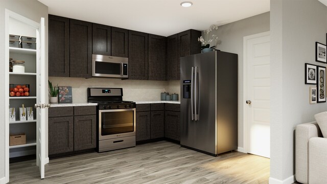 kitchen with tasteful backsplash, appliances with stainless steel finishes, light wood-type flooring, and dark brown cabinetry