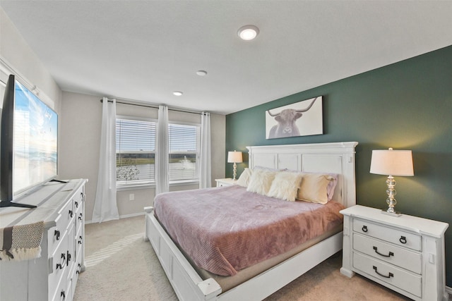 carpeted bedroom featuring multiple windows