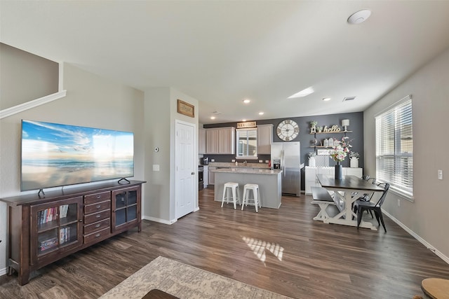 living room with dark hardwood / wood-style floors