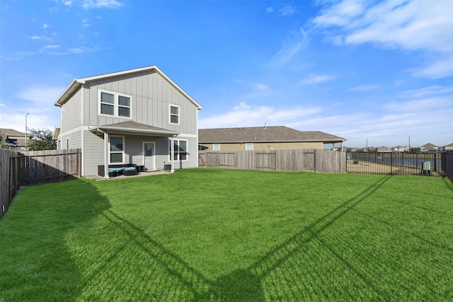 rear view of house with a lawn