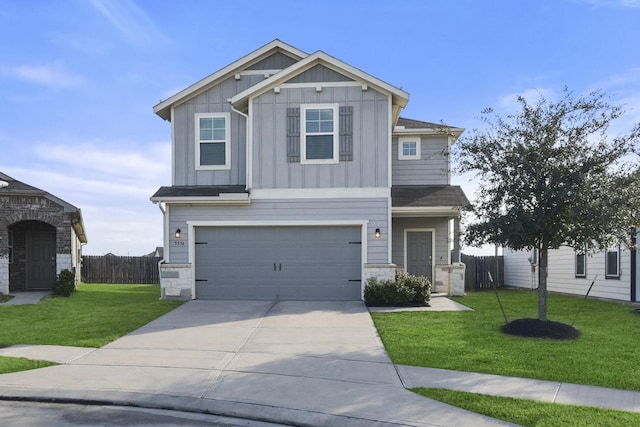 craftsman-style house featuring a garage and a front yard