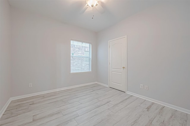 empty room with light hardwood / wood-style flooring