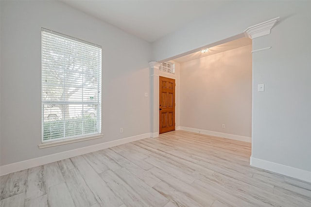 unfurnished room with light wood-type flooring