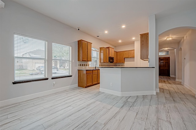 kitchen featuring sink and light wood-type flooring