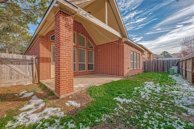 view of side of home with a patio