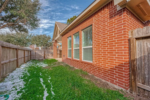 view of property exterior with a yard