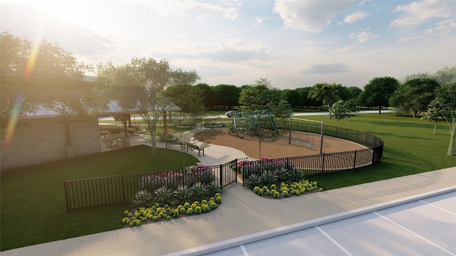 view of property's community featuring fence and a yard