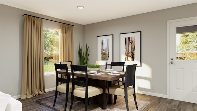 dining area featuring dark wood-style floors and baseboards