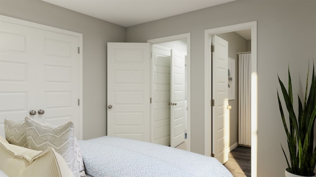 bedroom featuring wood-type flooring and a closet