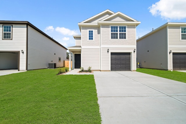 view of front of property featuring a garage, a front yard, central AC, and driveway