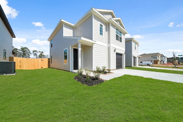 exterior space featuring a garage, central AC, fence, concrete driveway, and a yard