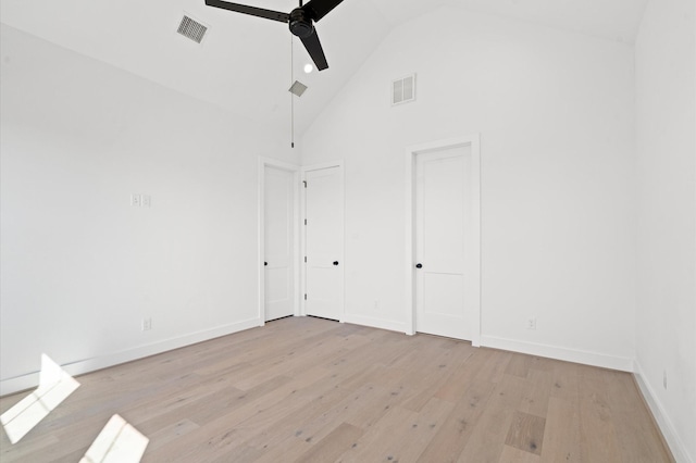 unfurnished room with light hardwood / wood-style flooring, high vaulted ceiling, and ceiling fan