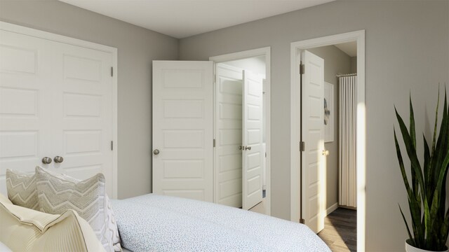 bedroom with hardwood / wood-style floors and a closet