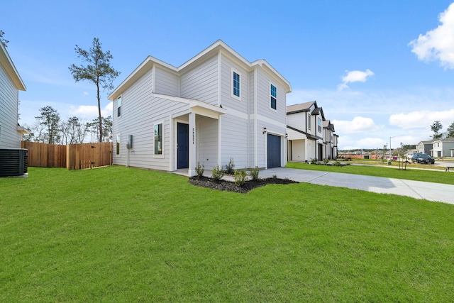 view of front of property with cooling unit, a garage, fence, concrete driveway, and a front lawn