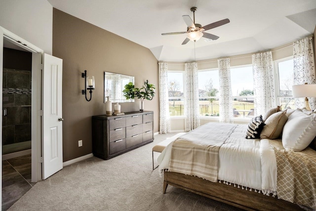 bedroom featuring vaulted ceiling, ceiling fan, and light colored carpet