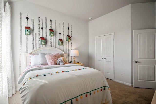 carpeted bedroom featuring a closet