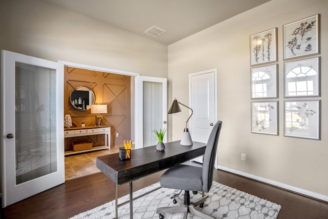 home office featuring wood-type flooring and french doors