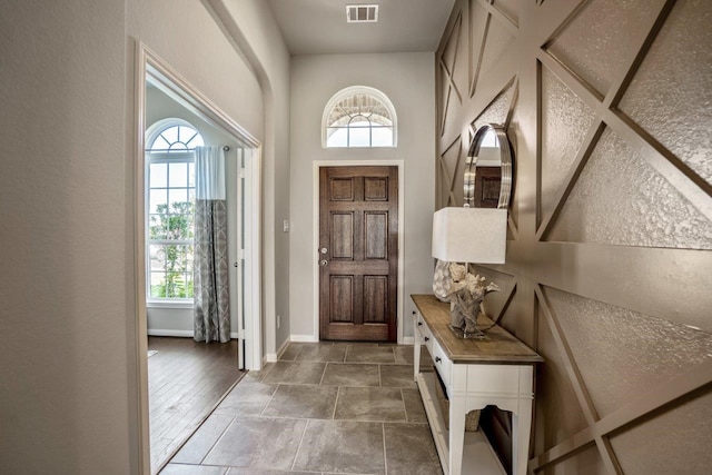 entrance foyer featuring plenty of natural light