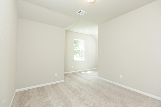 unfurnished room featuring light colored carpet