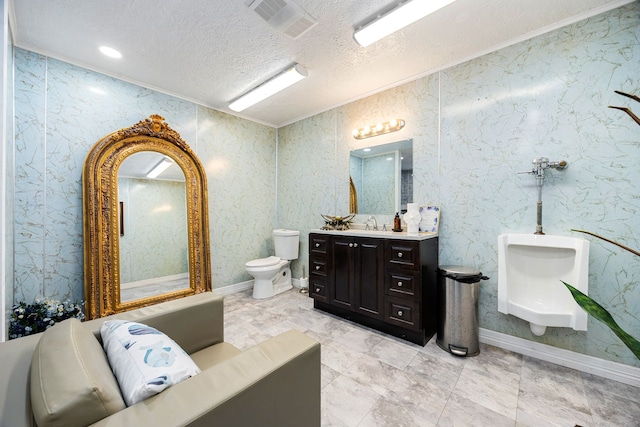 bathroom with vanity, crown molding, a textured ceiling, and toilet