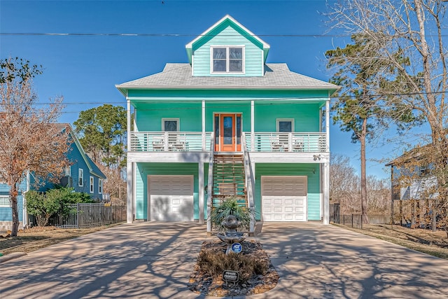 view of front of home with a porch and a garage