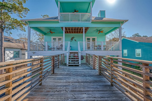 view of front of home featuring ceiling fan and french doors