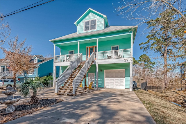 view of front of house featuring a garage and a porch