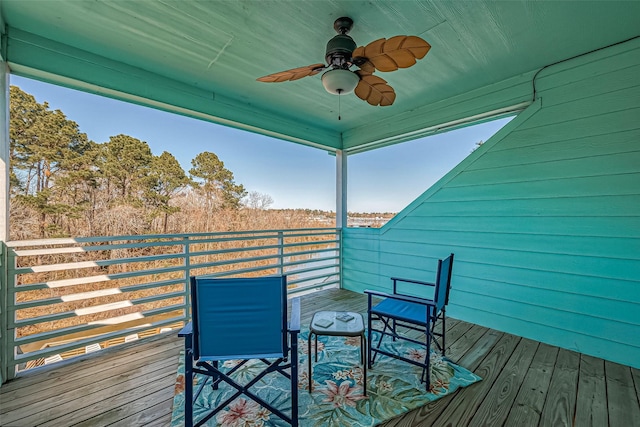 wooden deck featuring ceiling fan