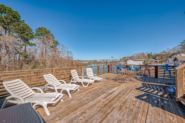 wooden terrace with a water view