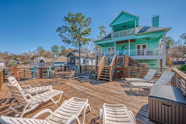 wooden deck featuring ceiling fan