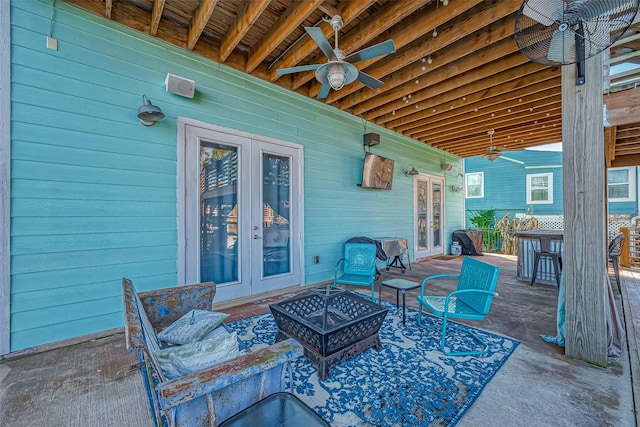 view of patio / terrace with french doors, ceiling fan, and an outdoor bar