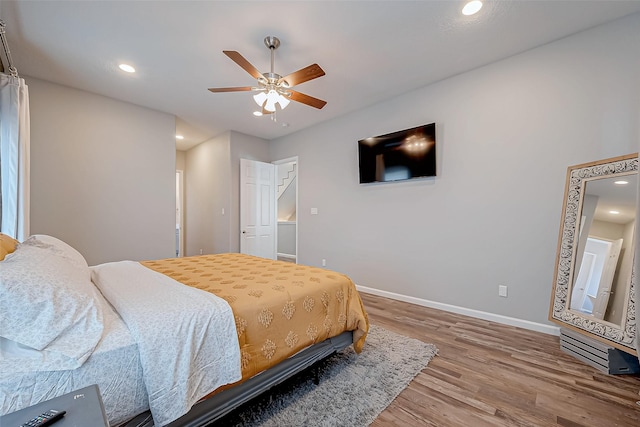 bedroom with hardwood / wood-style floors and ceiling fan