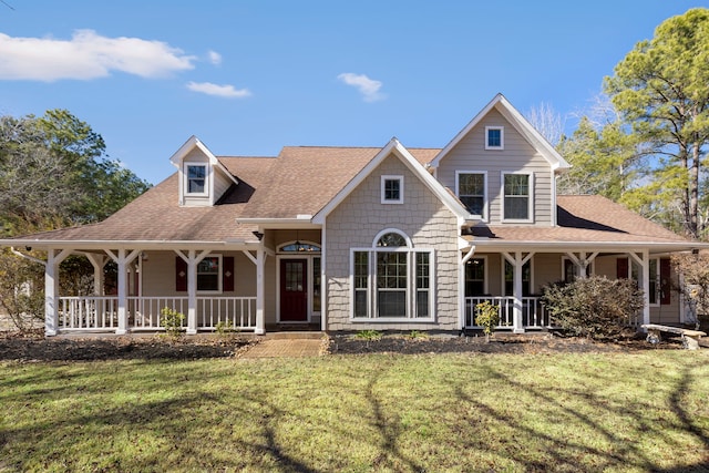 view of front of house with a front yard and covered porch