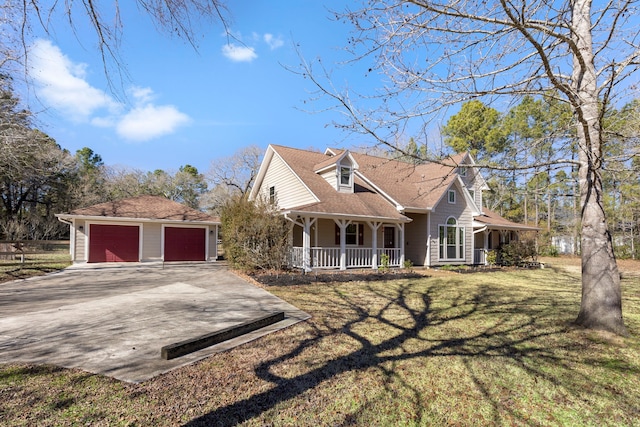 view of front of property featuring a garage, covered porch, and a front lawn