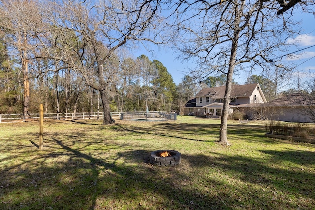 view of yard with an outdoor fire pit