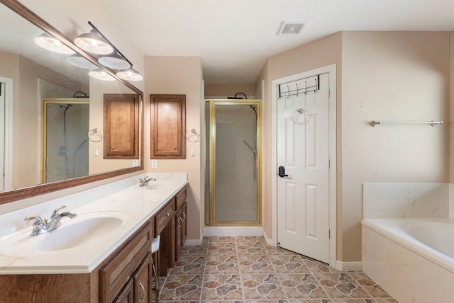 bathroom featuring vanity and separate shower and tub