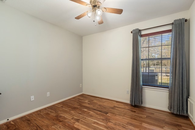 spare room with hardwood / wood-style flooring and ceiling fan