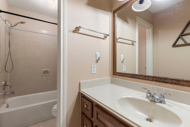 full bathroom with shower / bath combination, vanity, tile patterned flooring, and toilet