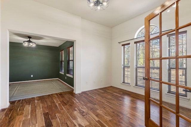 empty room featuring dark wood-type flooring