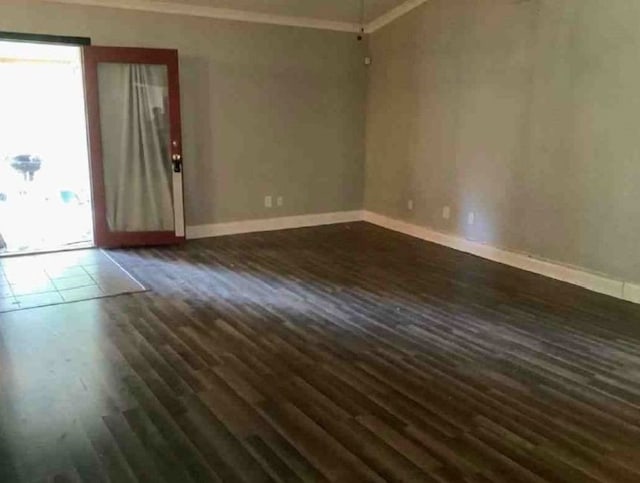 unfurnished room featuring dark hardwood / wood-style flooring