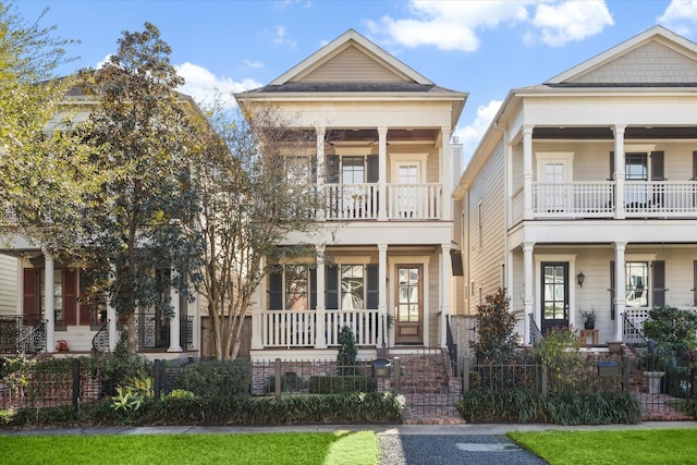 view of front of house featuring a balcony and a porch